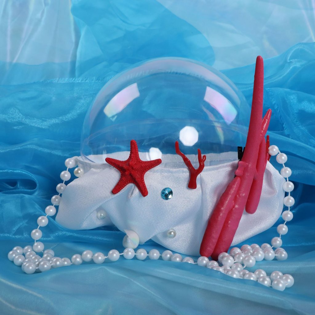 Dolia white sea-themed shoulder bag with clear dome, red coral and pearl-like strap
