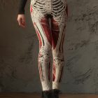 Cream skeleton bone leggings with red anatomical accents