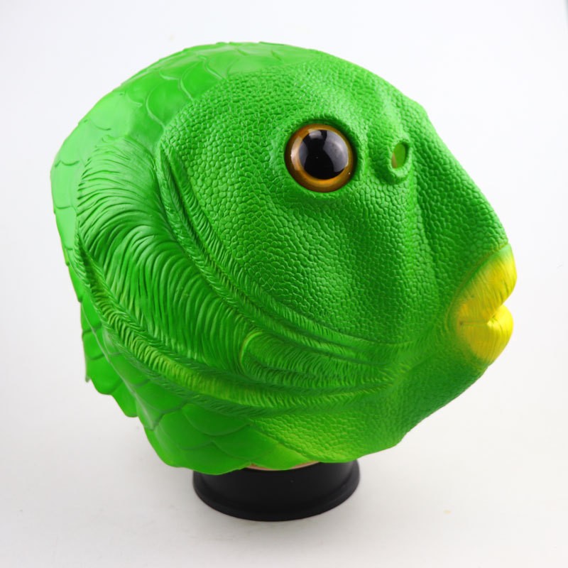 Green fish head mask side view with textured fins and yellow lips