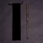 Brown vine-wrapped wizard wand beside drawstring pouch