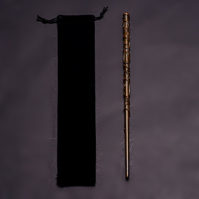 Brown vine-wrapped wizard wand beside drawstring pouch
