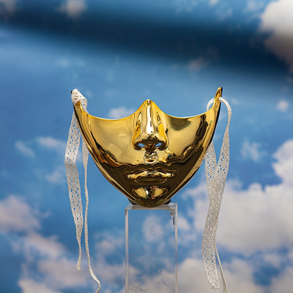 Gold sculpted lower-face mask with side ties