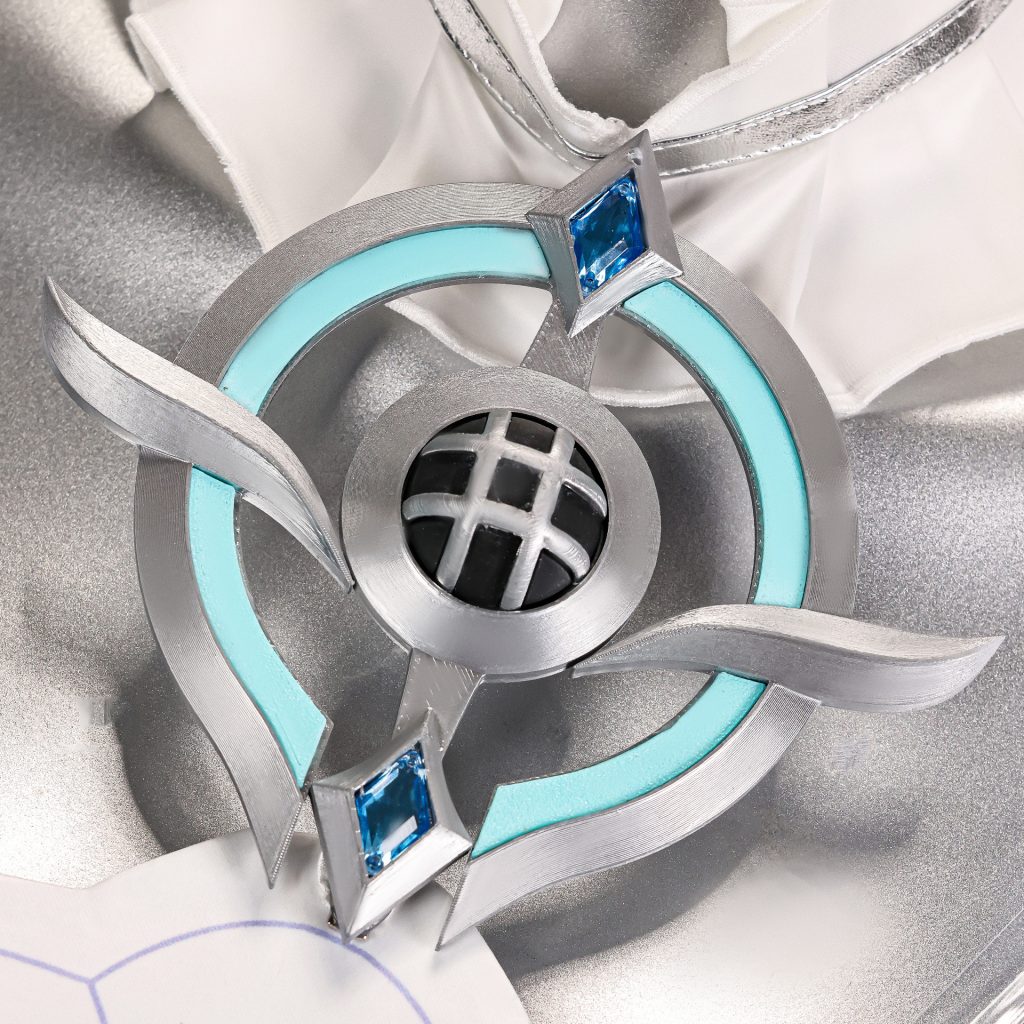 Close-up of blue silver costume chest ornament