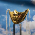 Gold mechanical lower-face mask with raised panel details