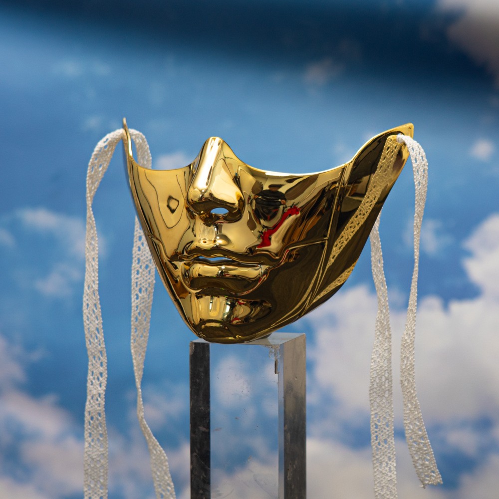Gold mechanical lower-face mask with raised panel details