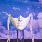 White mechanical lower-face mask with raised chin lines
