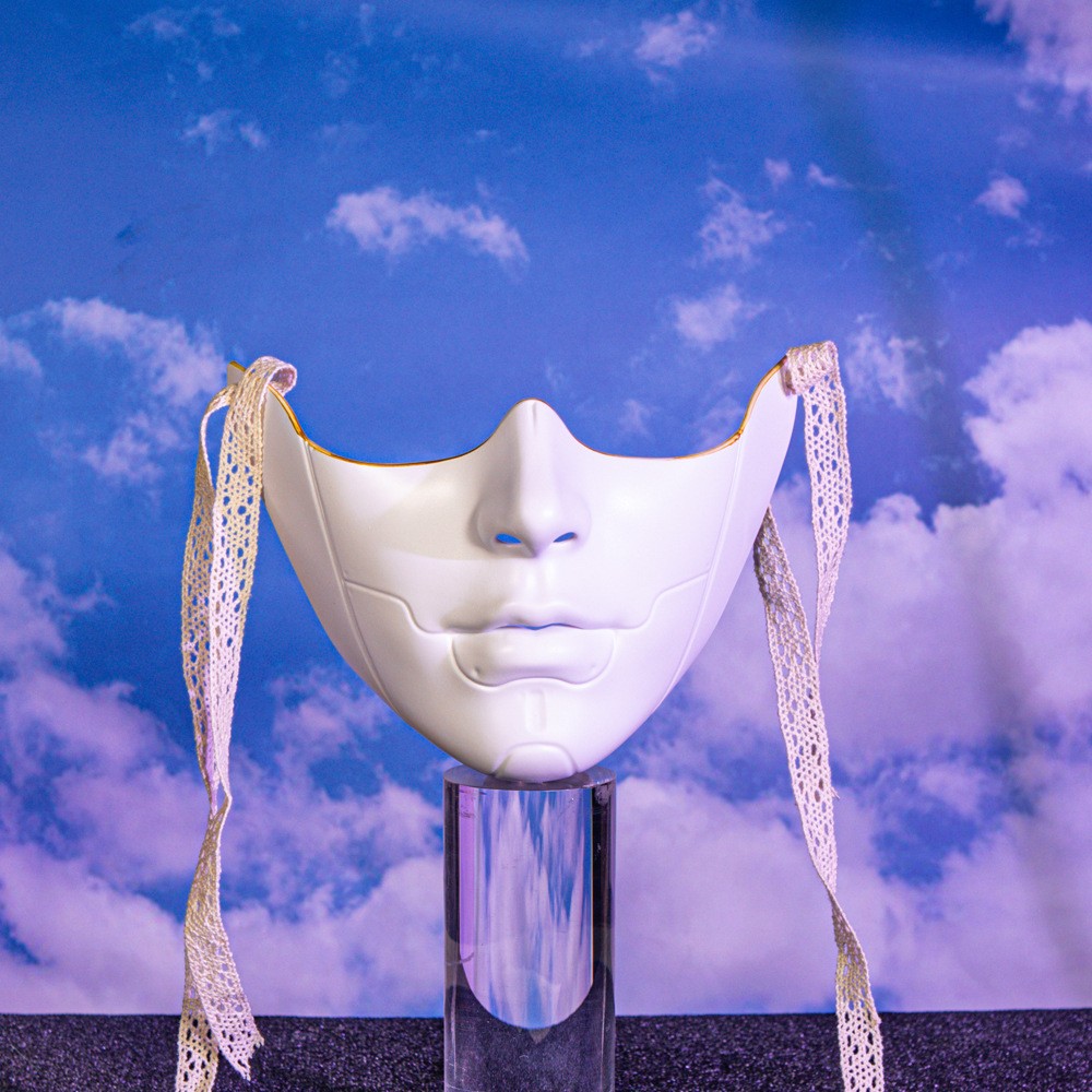White mechanical lower-face mask with raised chin lines