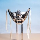 Silver mechanical lower-face mask showing reflective raised details