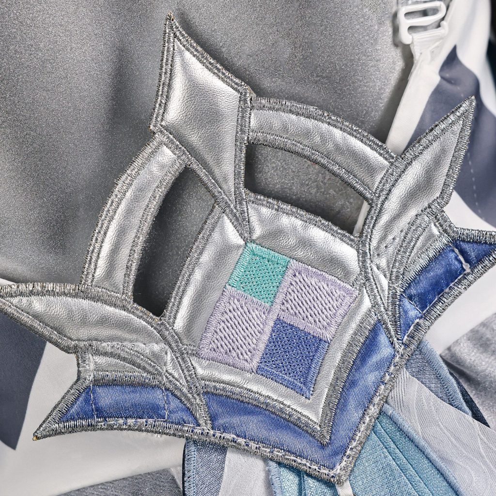 Close-up of blue and silver Vodyanitsa costume embroidery