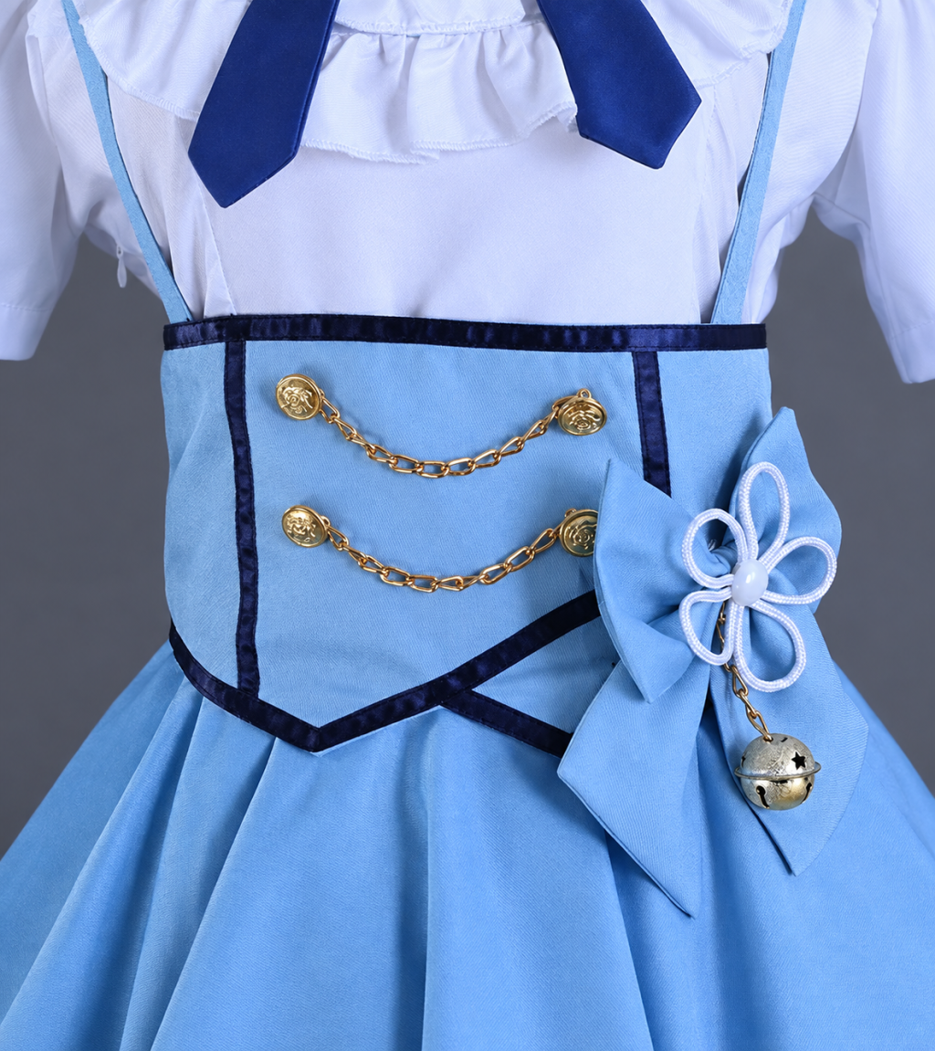 Costume waist detail with two gold-tone chains, blue bow and bell