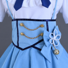 Costume waist detail with two gold-tone chains, blue bow and bell