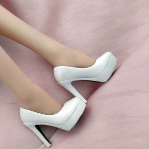 Pair of white platform high-heel pumps on 1:6 figure legs, side profile; figure not included